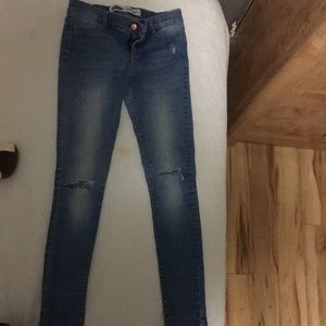 Old navy rockstar jeggings with rips in the knees